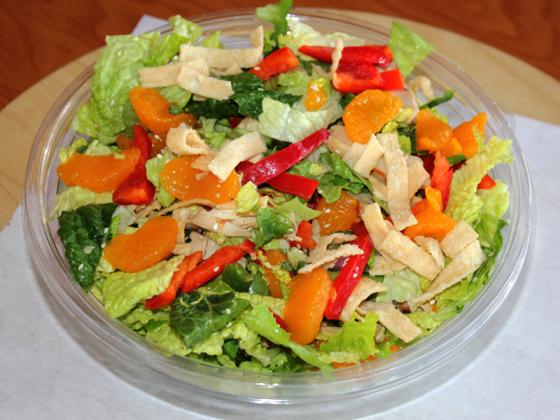 Mandarin chicken salad in a glass bowl