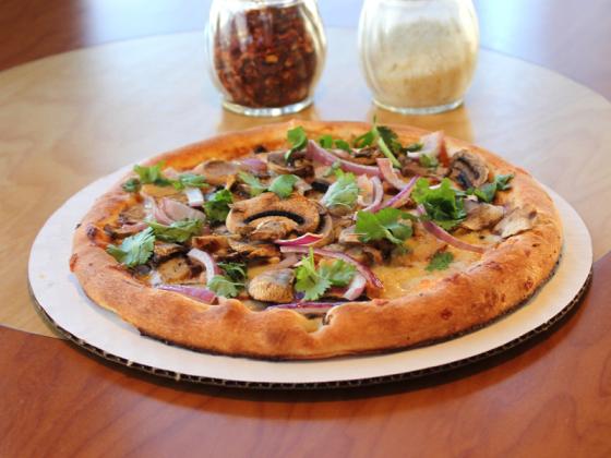 Thin crust mushroom and onion pizza